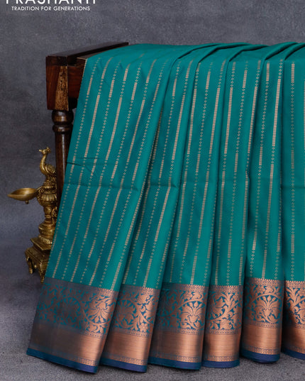Semi soft silk saree teal green and drak blue with allover copper zari weaves and copper zari woven border