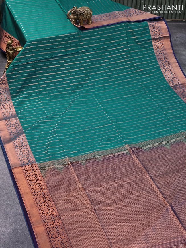 Semi soft silk saree teal green and drak blue with allover copper zari weaves and copper zari woven border