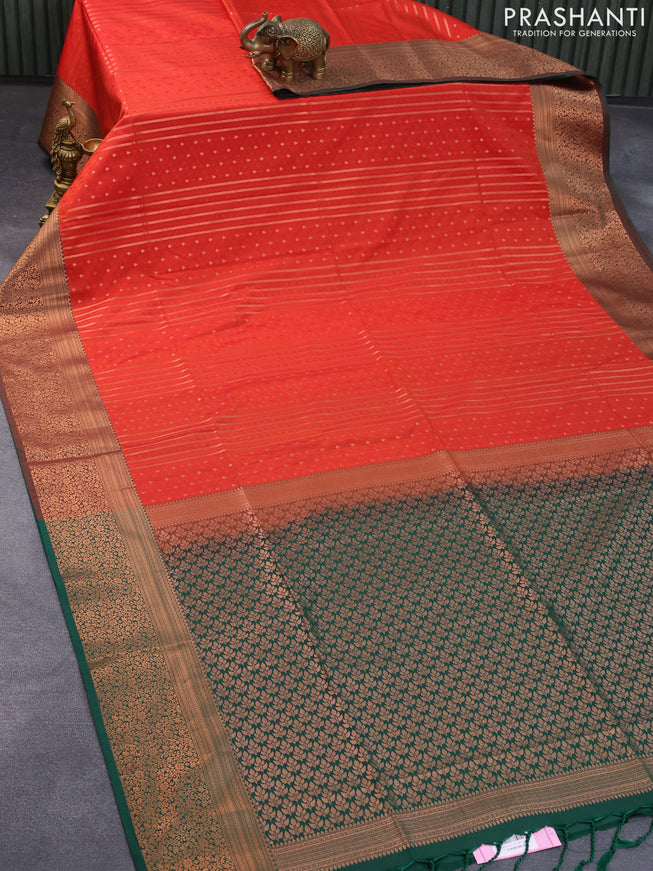 Semi soft silk saree reddish orange and dark green with allover self emboss & stripes and copper zari woven border