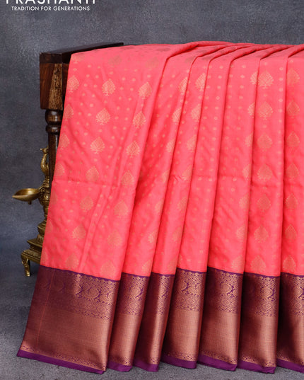 Semi soft silk saree peach pink and purple with allover zari woven buttas and copper zari woven border