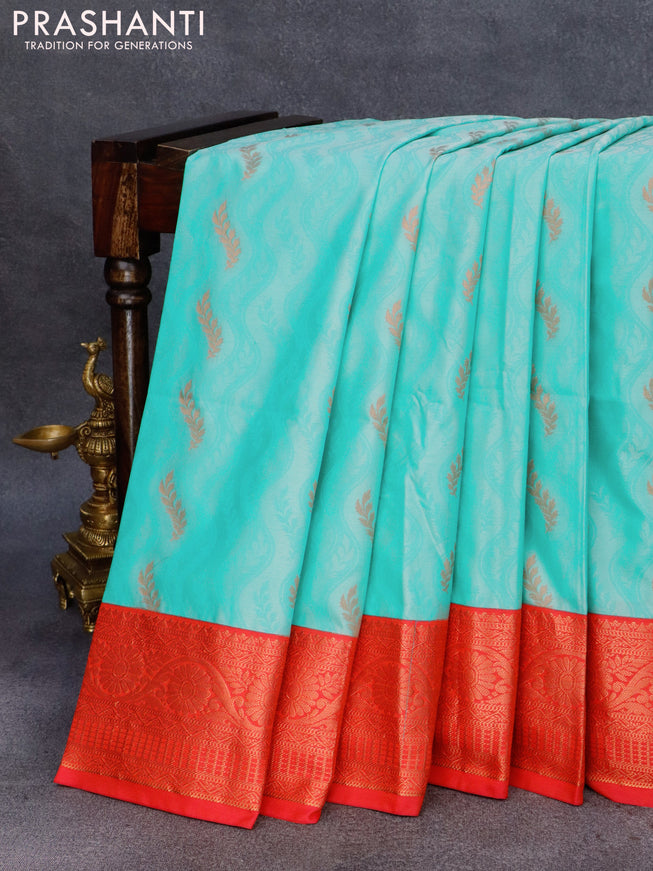 Semi soft silk saree teal blue and dual shade of pinkish orange with allover self emboss & zari buttas and zari woven border