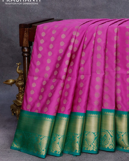 Semi soft silk saree pink and green with allover zari woven buttas and zari woven annam border
