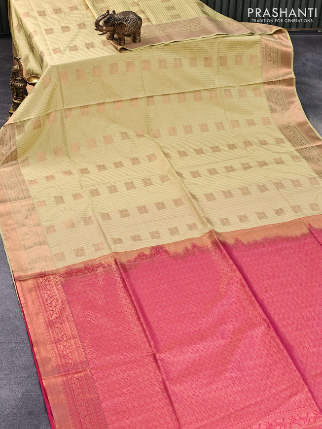 Semi soft silk saree pale yellow shade and pink with allover zari stripes & buttas and copper zari woven border