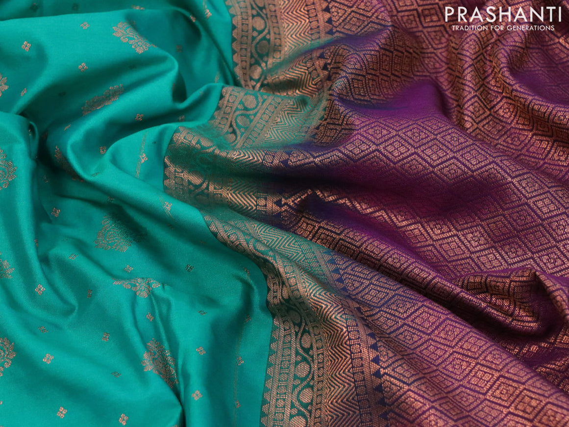 Semi soft silk saree teal green and purple with allover copper zari woven buttas and copper zari woven border