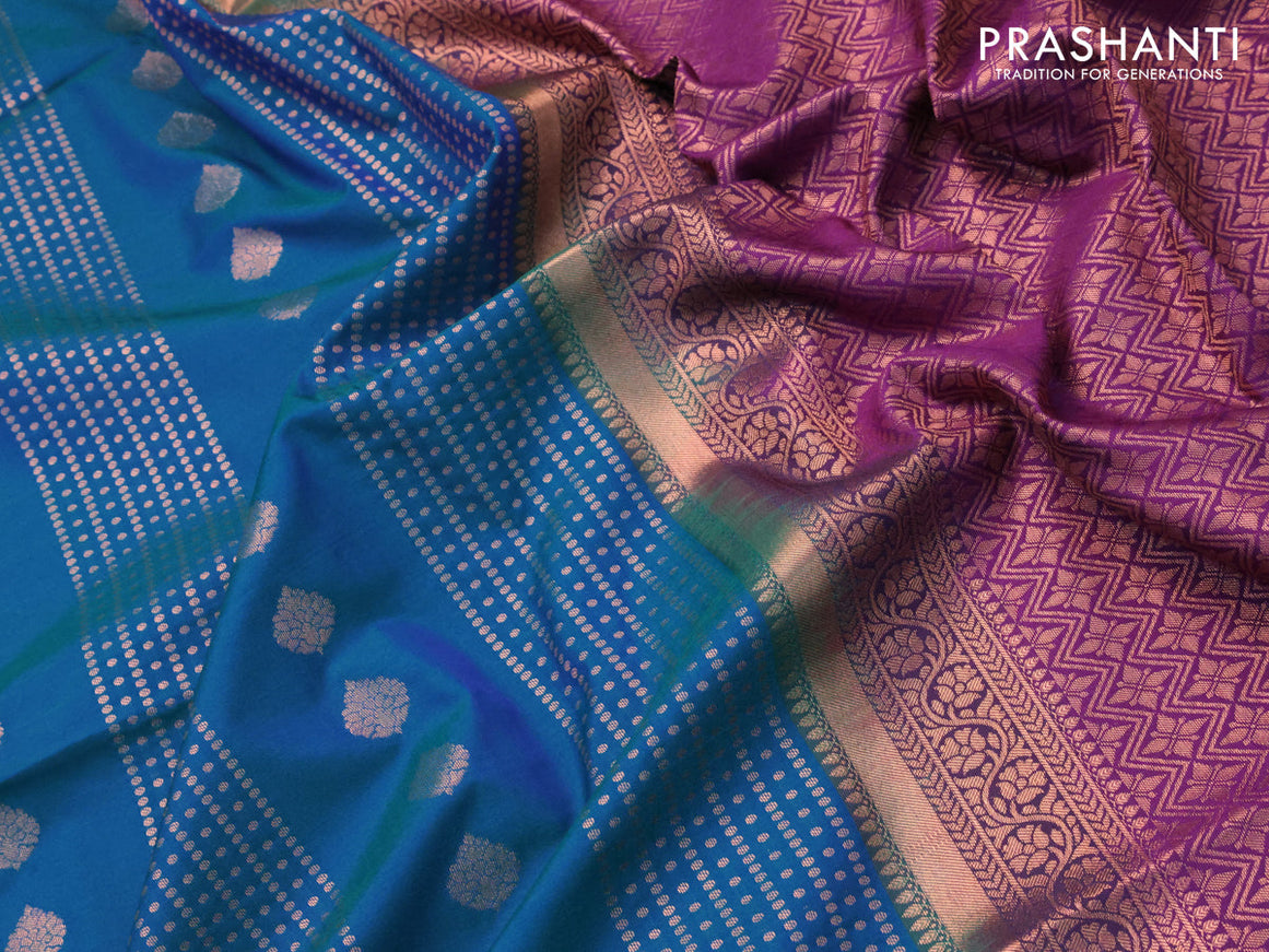 Semi soft silk saree dual shade of bluish green and purple with allover copper zari weaves and copper zari woven border