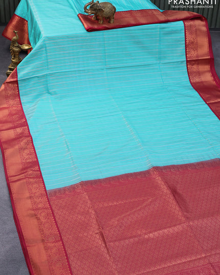 Semi soft silk saree light blue and maroon with allover zari weaves and copper zari woven border