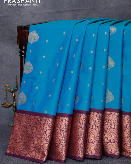 Semi soft silk saree dual shade of blue and deep violet with allover zari woven butta weaves and copper zari woven border