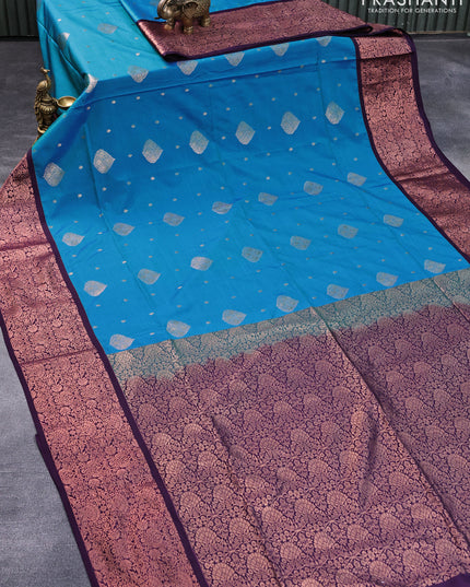 Semi soft silk saree dual shade of blue and deep violet with allover zari woven butta weaves and copper zari woven border
