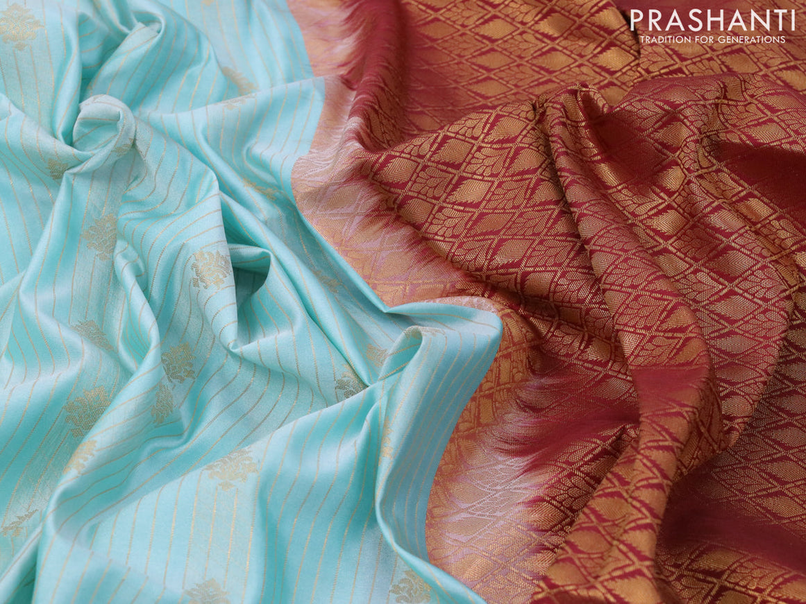 Semi soft silk saree light blue and maroon with allover zari weaves and zari woven border