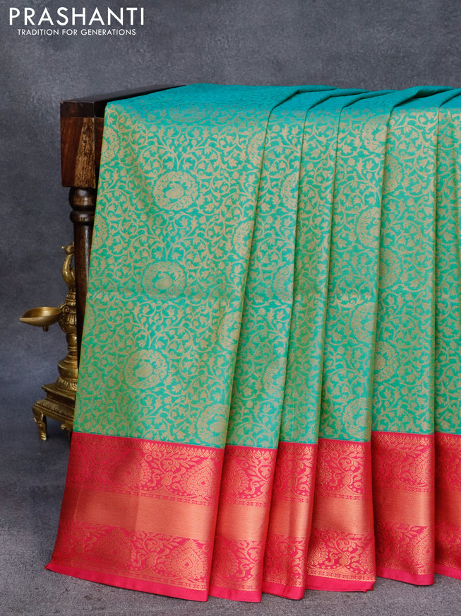 Semi soft silk saree light green and pink with allover zari weaves and copper zari woven border