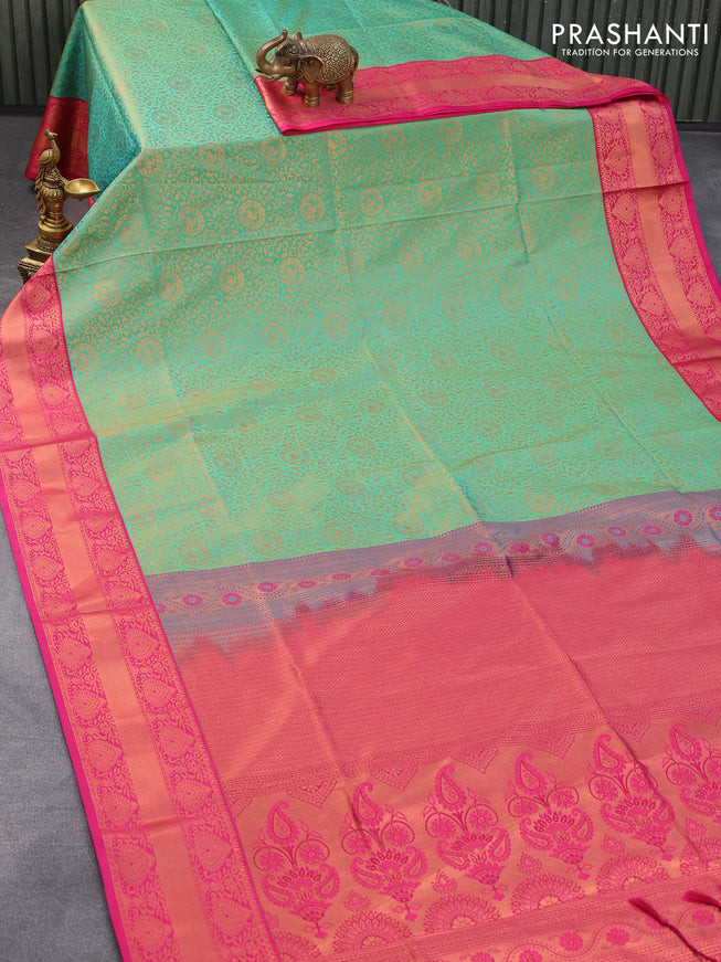 Semi soft silk saree light green and pink with allover zari weaves and copper zari woven border