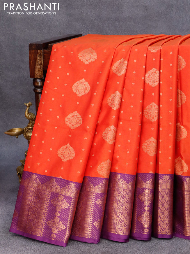 Semi soft silk saree orange and purple with allover copper zari woven buttas and copper zari woven border