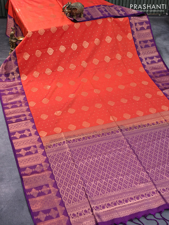 Semi soft silk saree orange and purple with allover copper zari woven buttas and copper zari woven border