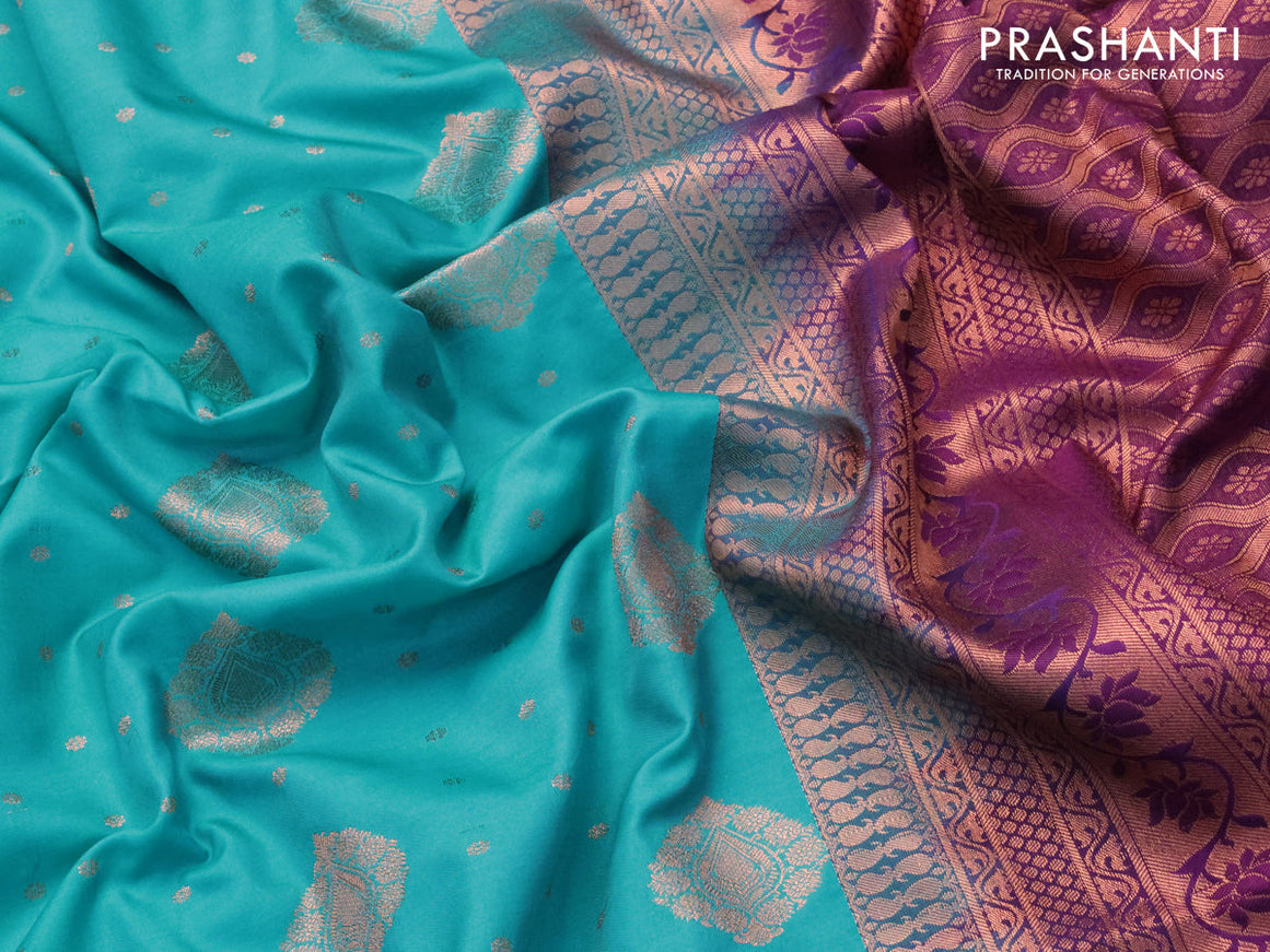 Semi soft silk saree light blue and purple with allover copper zari woven buttas and copper zari woven border