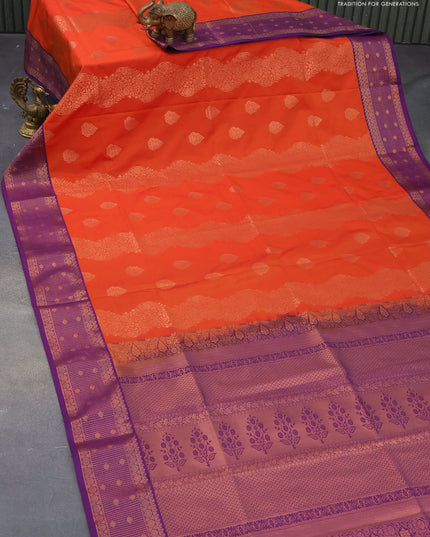Semi soft silk saree orange and deep purple with allover zari woven buttas and copper zari woven border