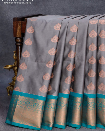 Semi soft silk saree grey and teal green with allover copper zari woven buttas and zari woven border