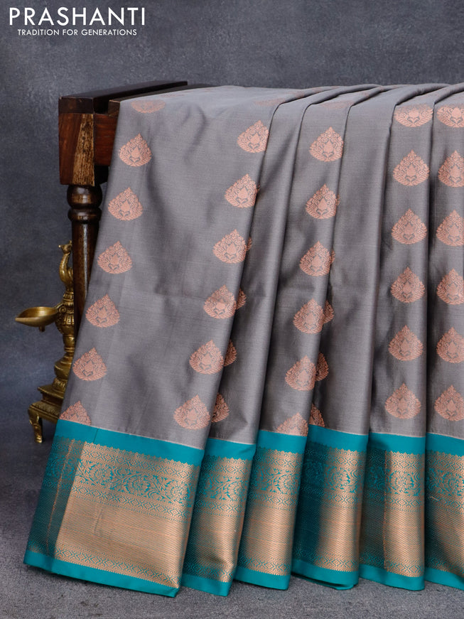 Semi soft silk saree grey and teal green with allover copper zari woven buttas and zari woven border