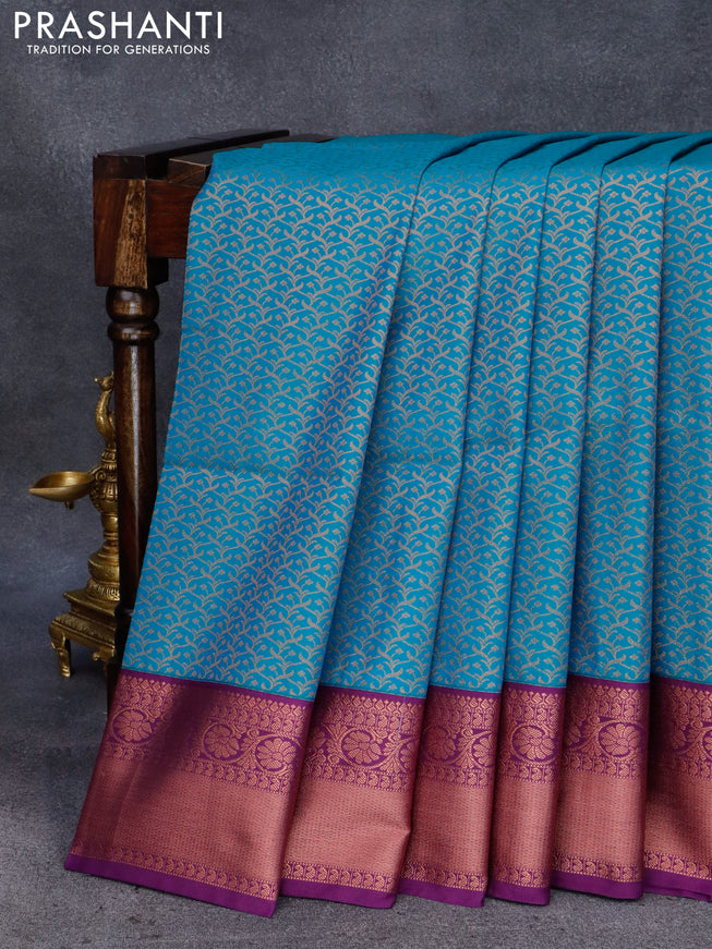 Semi soft silk saree cs blue and purple with allover copper zari woven brocade weaves and copper zari woven border
