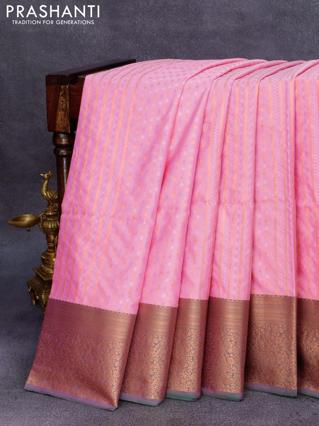 Semi soft silk saree candy pink and peacock green with allover self emboss & zari weaves and rich copper zari woven border