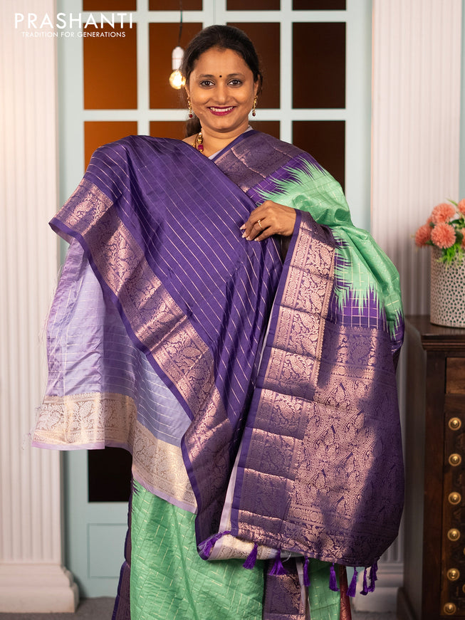 Semi raw silk saree teal green and violet with allover zari checked pattern and temple design copper zari woven border