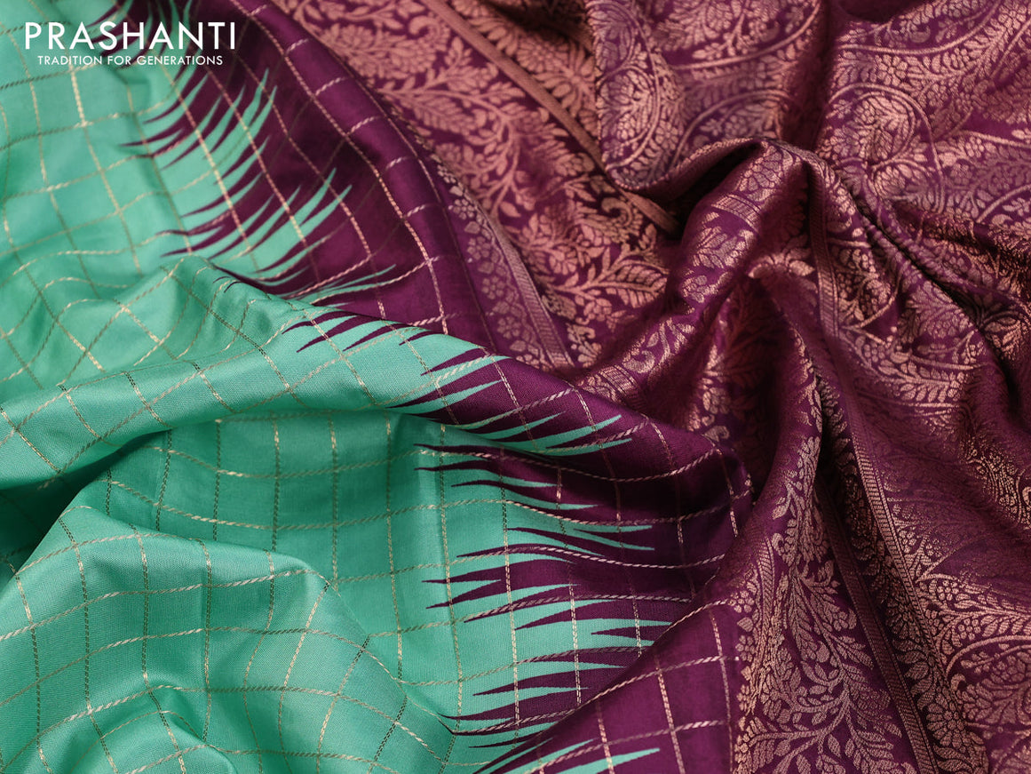 Semi raw silk saree teal blue shade and purple with allover zari checked pattern and temple design copper zari woven border