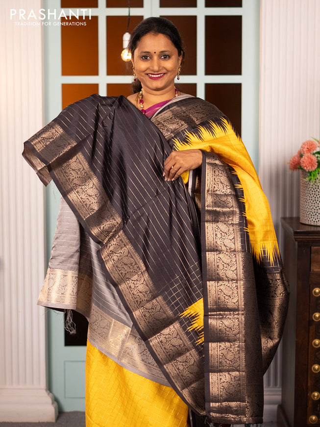 Semi raw silk saree yellow and black with allover zari checked pattern and temple design copper zari woven border