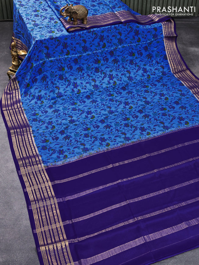 Printed crepe silk saree blue and dark blue with allover floral prints and zari woven border
