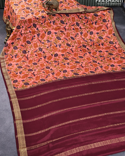 Printed crepe silk saree peach orange and maroon with allover pichwai prints and zari woven border