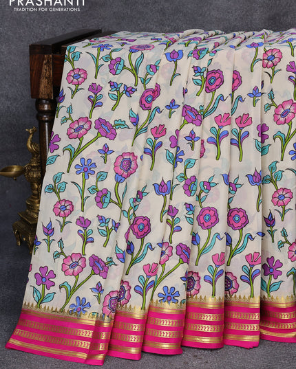 Printed crepe silk saree cream and pink with allover floral prints and zari woven border