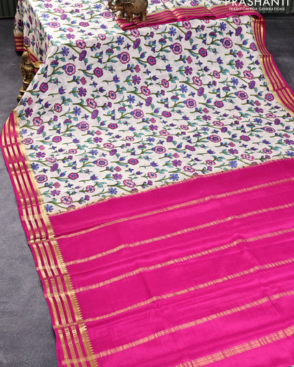 Printed crepe silk saree cream and pink with allover floral prints and zari woven border