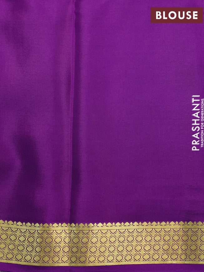 Printed crepe silk saree pastel pink and violet with allover floral prints and zari woven border