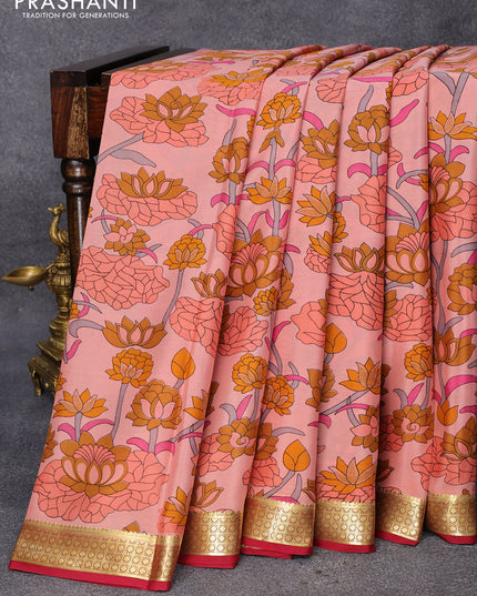 Printed crepe silk saree peach orange shade and maroon with allover floral prints and zari woven border
