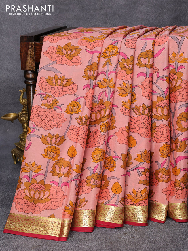 Printed crepe silk saree peach orange shade and maroon with allover floral prints and zari woven border