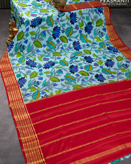 Printed crepe silk saree light blue and red with allover pichwai prints and zari woven border