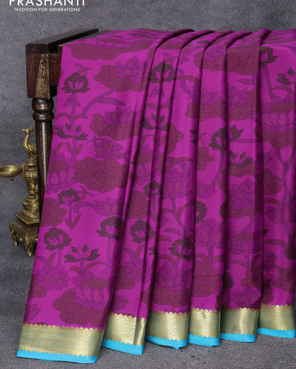 Printed crepe silk saree magenta pink and blue with allover floral prints and zari woven border