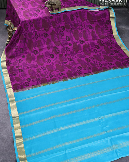 Printed crepe silk saree magenta pink and blue with allover floral prints and zari woven border