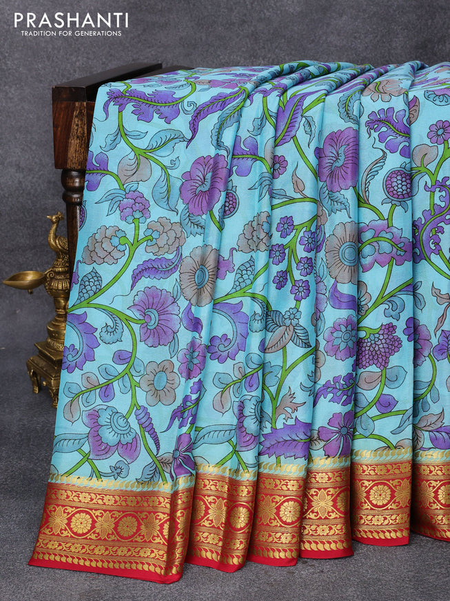 Printed crepe silk saree teal blue and kum kum red with allover kalamkari prints and zari woven border