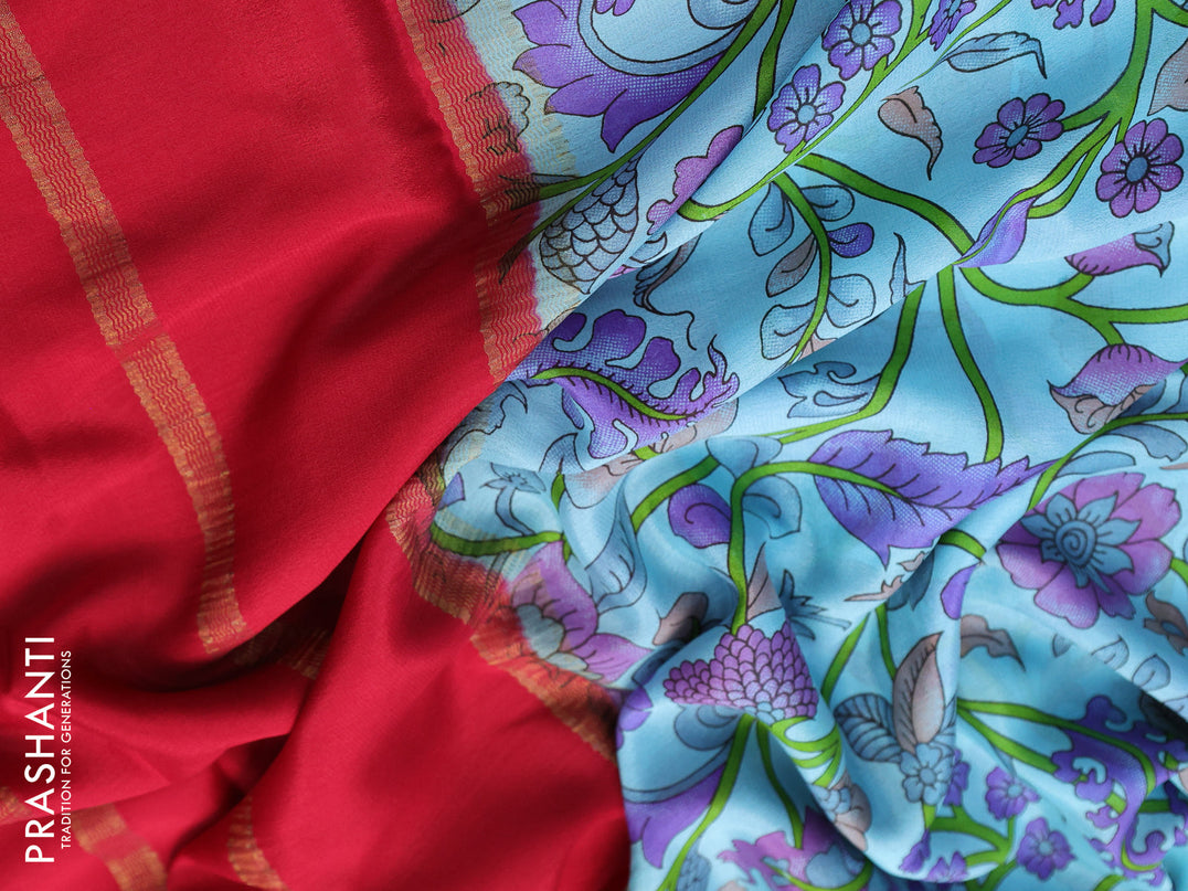 Printed crepe silk saree teal blue and kum kum red with allover kalamkari prints and zari woven border