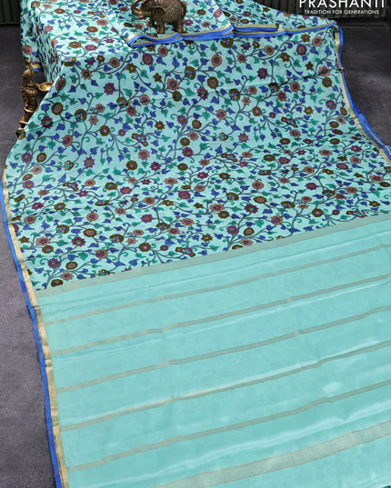 Printed crepe silk saree teal blue and blue with allover kalamkari prints and small zari woven border