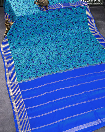 Printed crepe silk saree blue and royal blue with allover prints and zari woven border