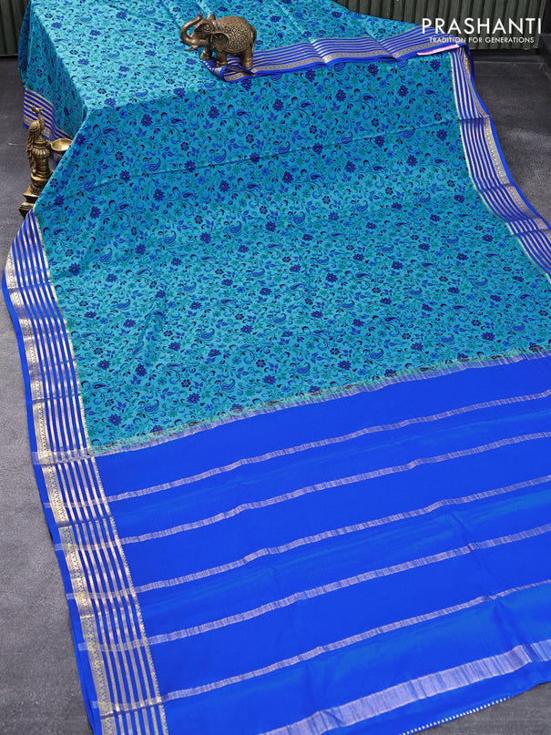 Printed crepe silk saree blue and royal blue with allover prints and zari woven border
