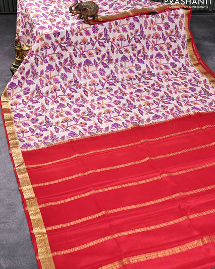 Printed crepe silk saree pastel peach shade and red with allover prints and zari woen border