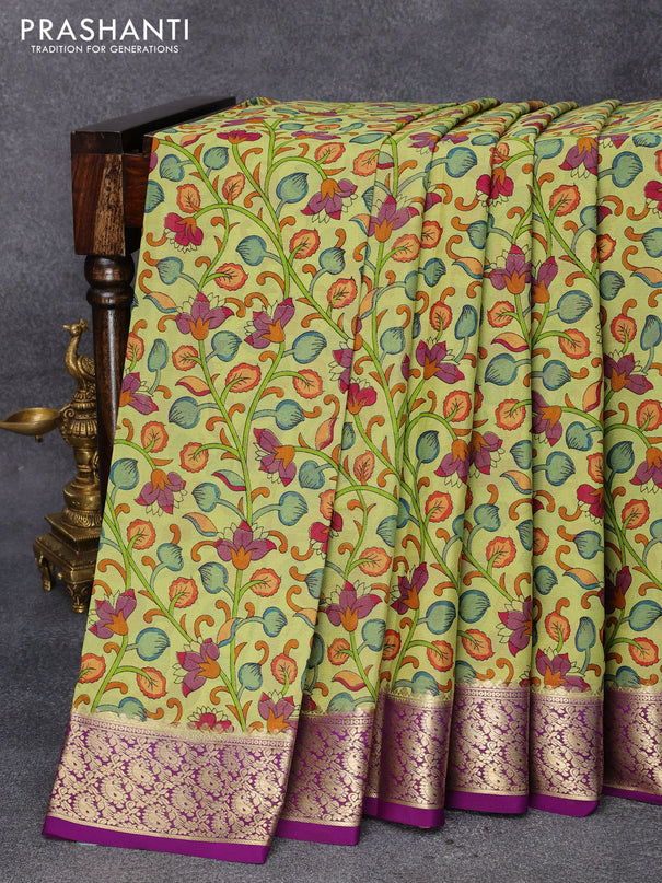 Printed crepe silk saree lime green and purple with allover kalamkari prints and paisley zari woven border