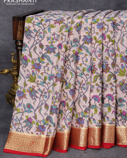Printed crepe silk saree pastel peach shade and kum kum red with allover kalamkari prints and zari woven border