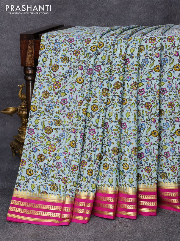 Printed crepe silk saree teal blue and pink with allover floral prints and zari woven border
