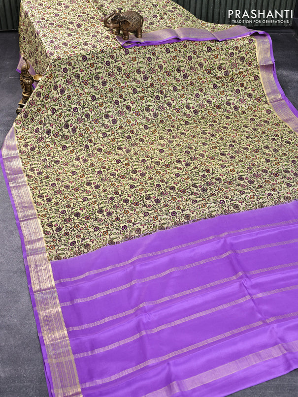 Printed crepe silk saree pale yellow and levender with allover floral prints and zari woven border