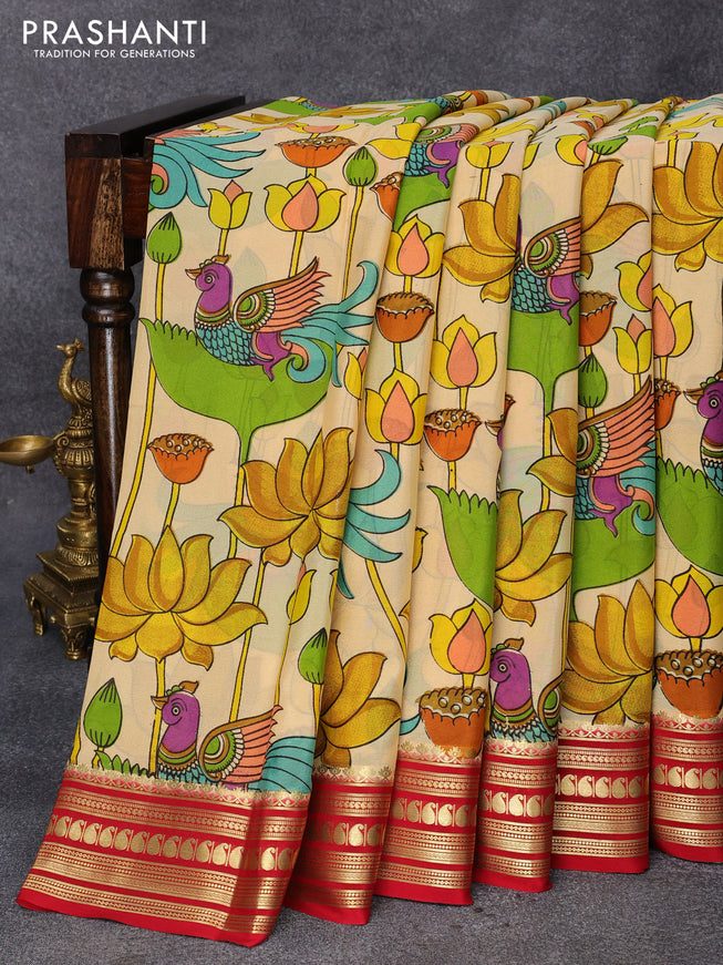 Printed crepe silk saree sandal and kum kum red with allover kalamkari prints and zari woven border