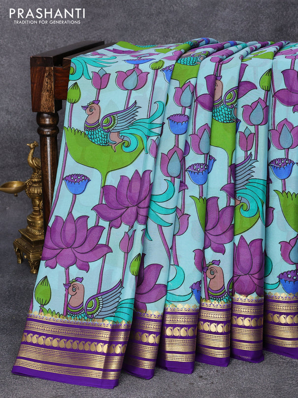 Printed crepe silk saree light blue and violet with allover kalamkari prints and zari woven border
