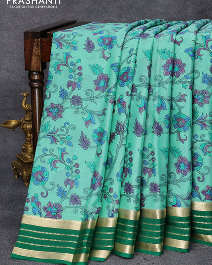 Printed crepe silk saree teal green and green with allover kalamkari prints and zari woven border
