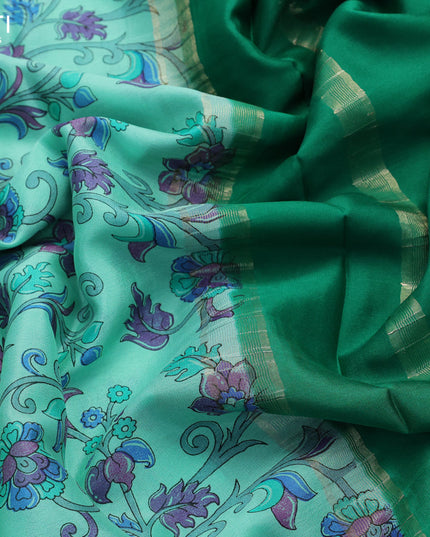 Printed crepe silk saree teal green and green with allover kalamkari prints and zari woven border